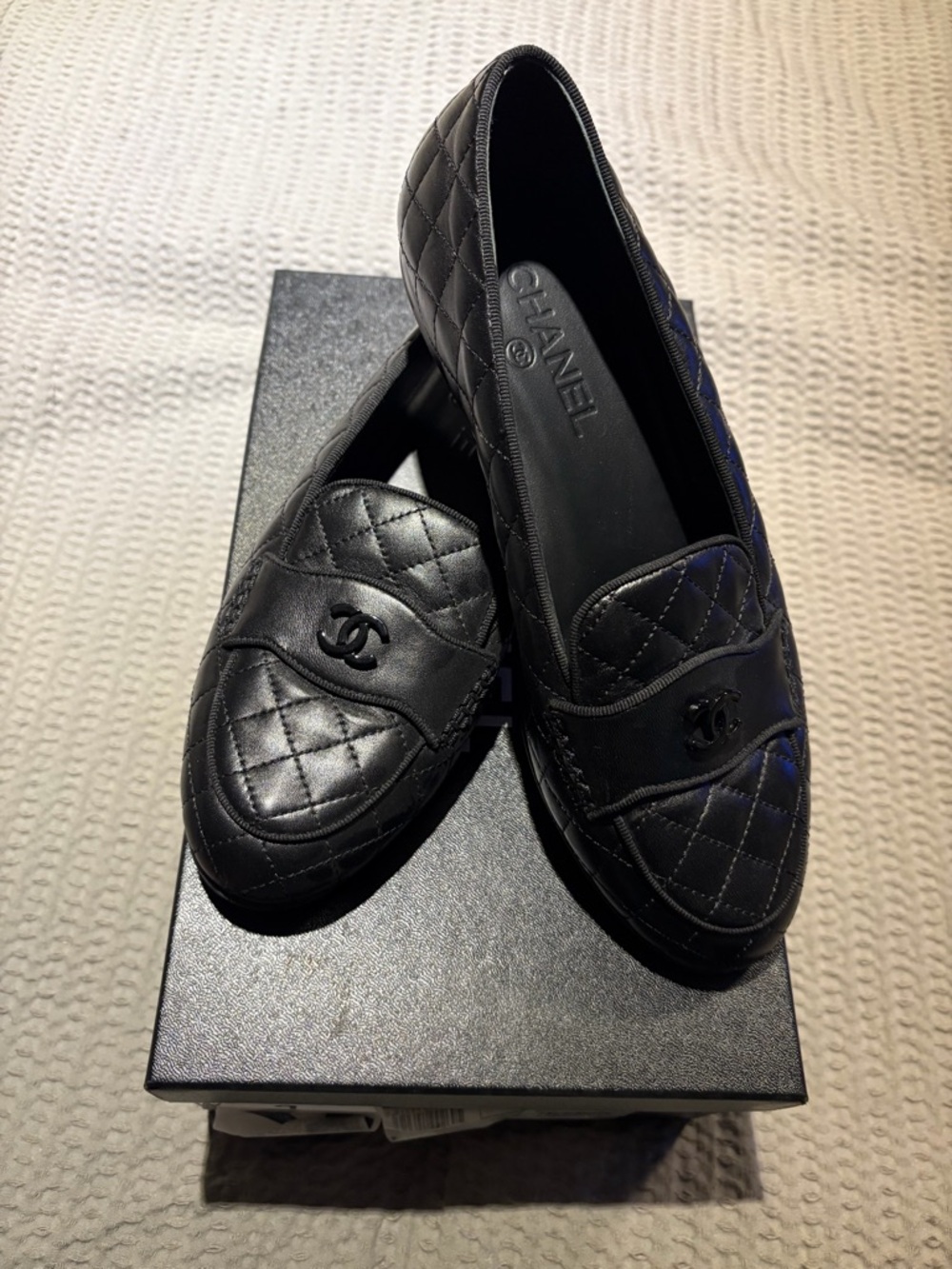 CHANEL Quilted Leather Loafers in Black